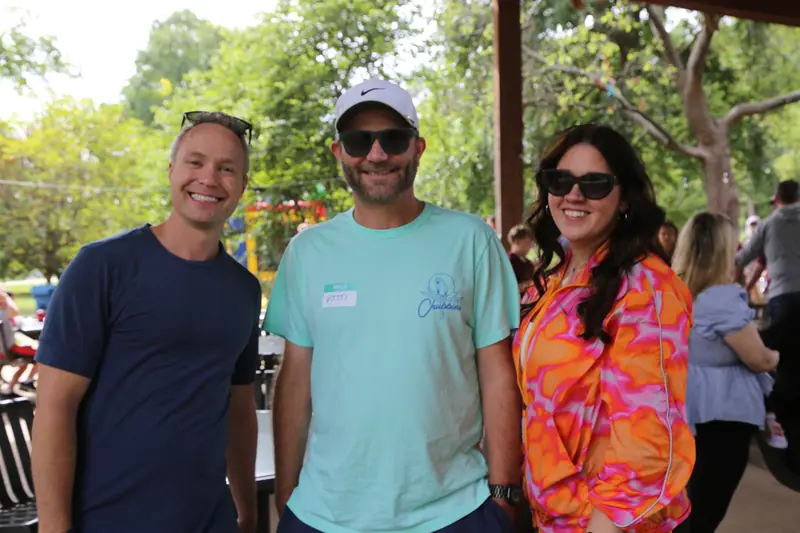 Three Abstrakt team members at the 2026 Company Picnic
