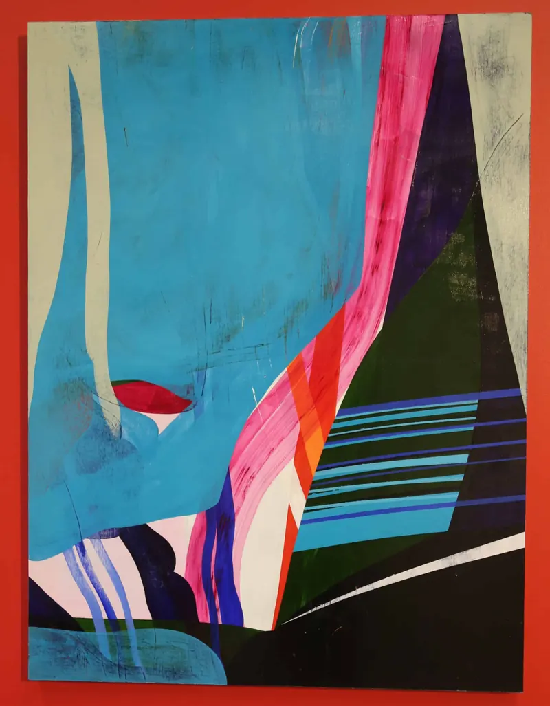 Abstract painting of sharp blue, pink and black shapes against a red border.