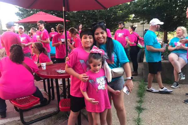 Team members and their kids volunteering together