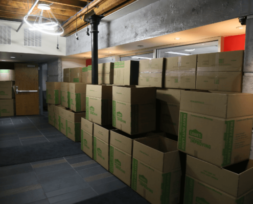 Moving boxes stacked in hall