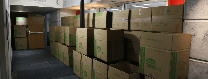 Moving boxes stacked in hall