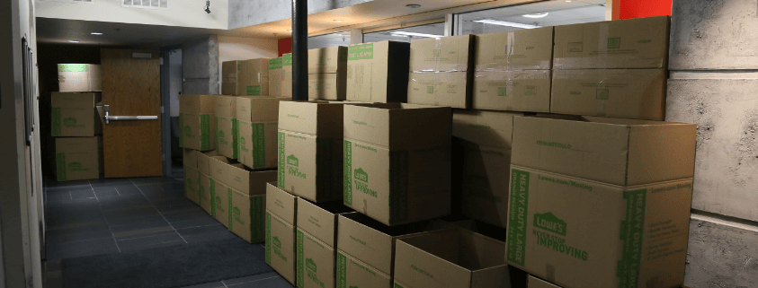 Moving boxes stacked in hall Moving boxes stacked in hall
