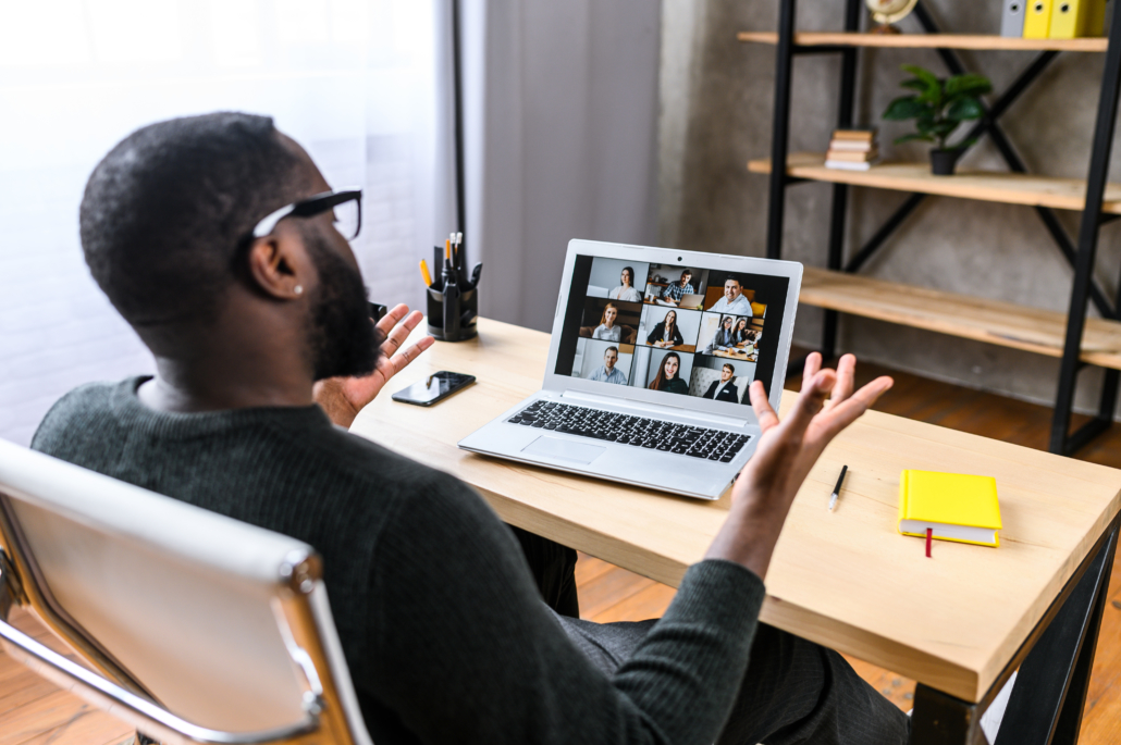 Business Growth During COVID-19 A guy talking online with employees via video call