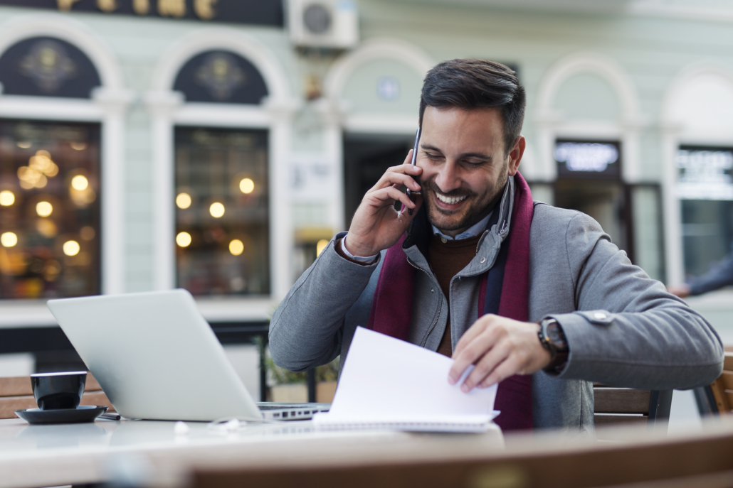 Cold Caller Businessman at coffee shop talking on the phone