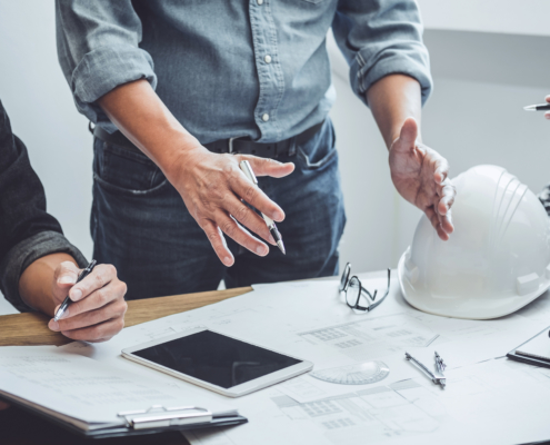 Construction and structure of Engineer or architect meeting for project working with partner and tools on model building and blueprint in working site