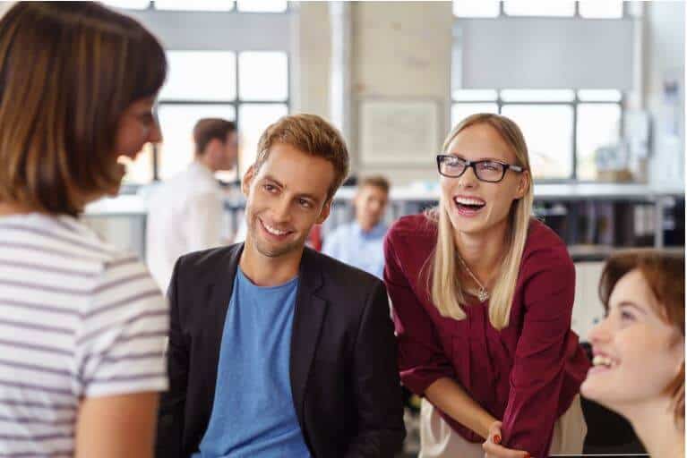9 Traits Every Great SDR Has sales team talking and laughing