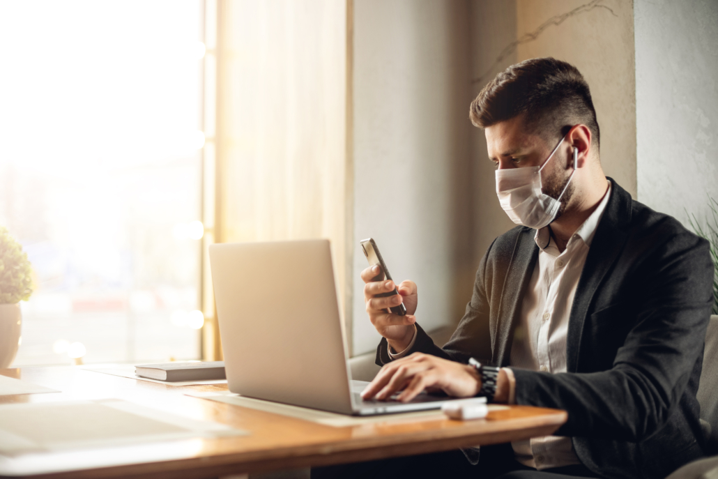 How COVID-19 Has Changed MSP Lead Generation Caucasian adult bearded man indoors in cafe. Lifestyle concept photo with copy space. Picture with handsome guy who using protective face mask. Portrait with gray laptop