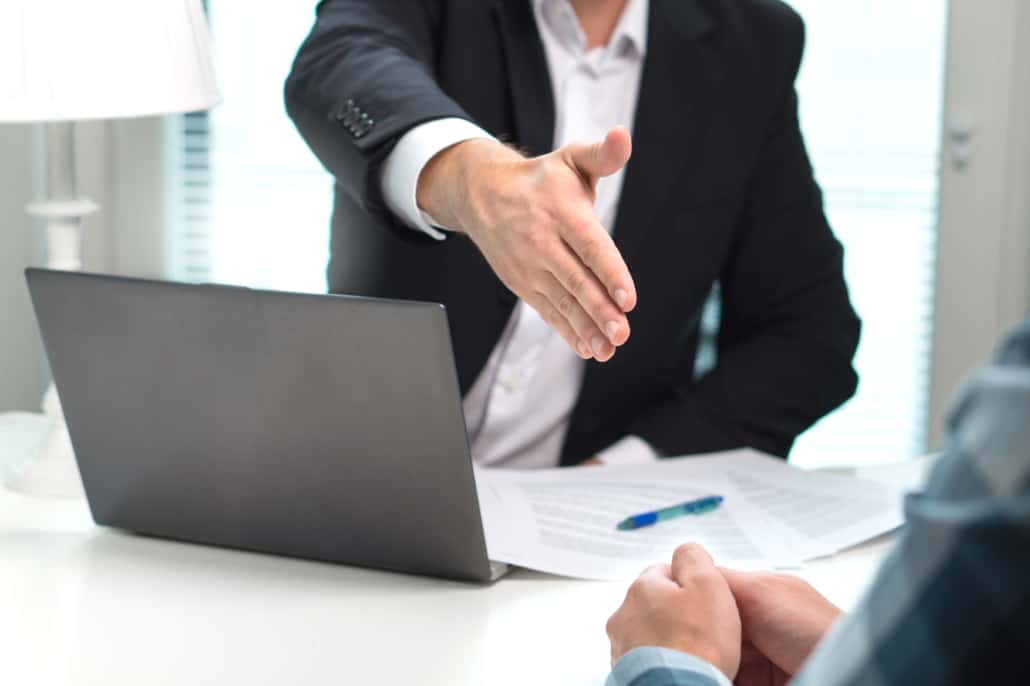 hiring-and-onboarding-a-sales-rep handshake after a job interview