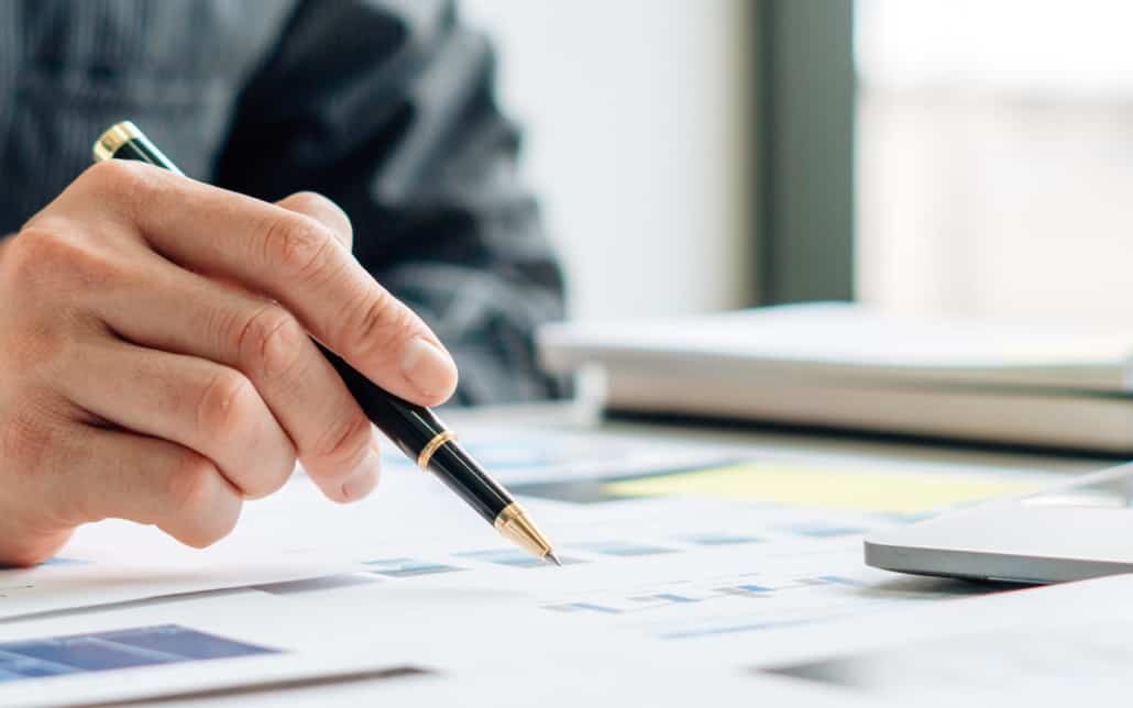 Close up view of person looking over insurance documents