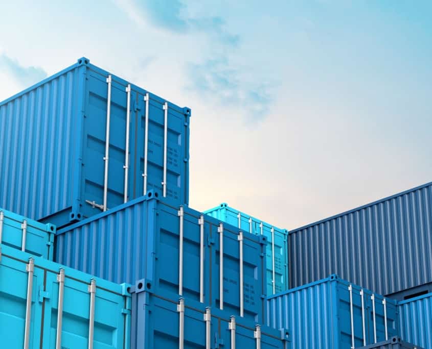 Side view of various blue shipping containers