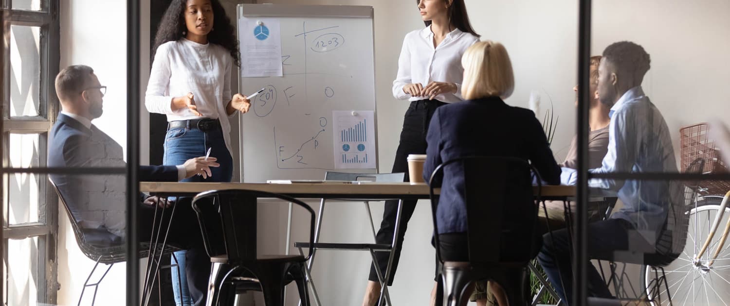 Team of people having a meeting inside office