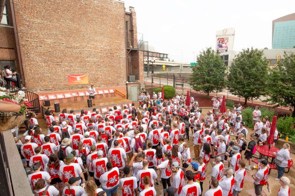 Crowd in front of stage on annual give back day