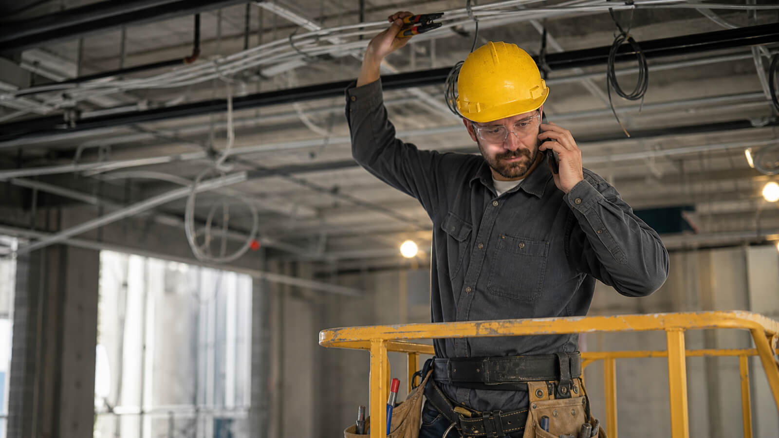 Commercial electrical contractor on the phone with a facility manager about next year capital plan