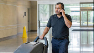 Commercial cleaning contractor walking a building with a property manager during a fall scope walkthrough