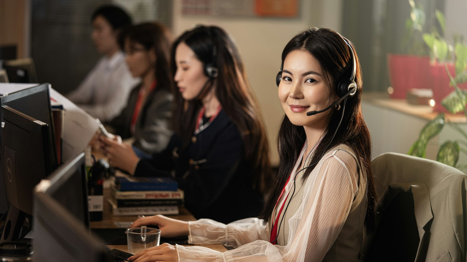Outbound sales team making calls with headsets
